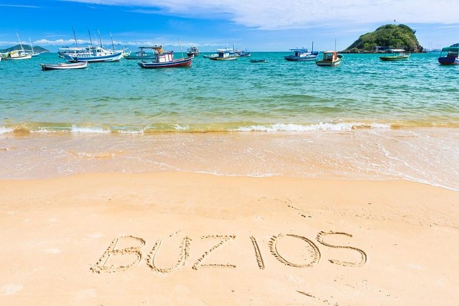 Guided Tour to Búzios with Boat Tour and Lunch - Praia da Tartaruga: calm water and wooden kiosks
